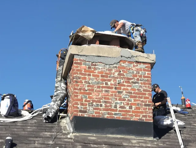 Mint Hill Chimney Sweep installing a custom chimney crown in Mint Hill, NC