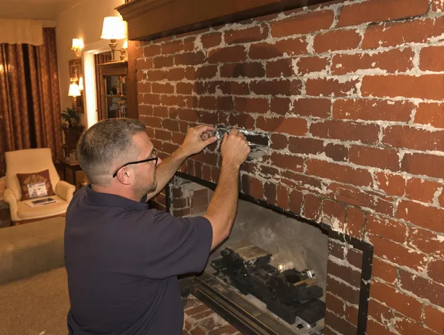 Mint Hill Chimney Sweep expert fixing a fireplace in Mint Hill, NC